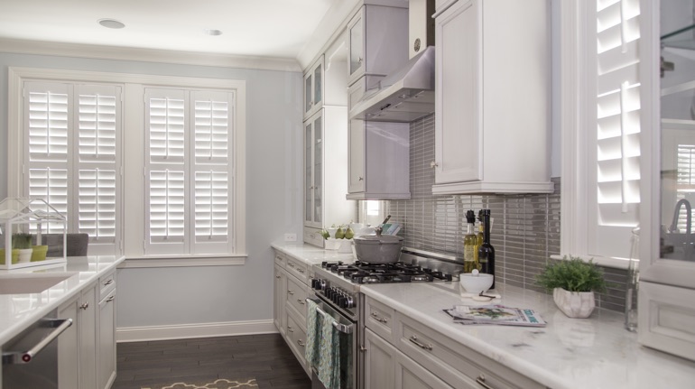 Polywood shutters in Minneapolis kitchen with modern appliances.